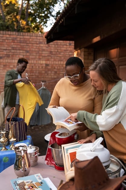 A diverse group of people participating in a hands-on cultural workshop at an outdoor festival, learning traditional crafting techniques.