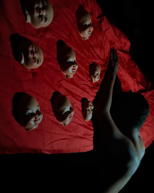 A dynamic, close-up shot of a diverse group of actors from the Steppenwolf Theatre Company mid-performance, conveying intense emotion and connection, with soft stage lighting highlighting their expressions.
