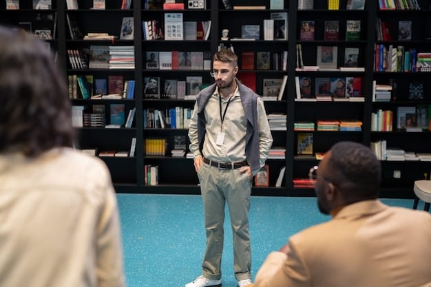 An author passionately speaking to a captivated audience at an indoor literary festival event, surrounded by bookshelves.
