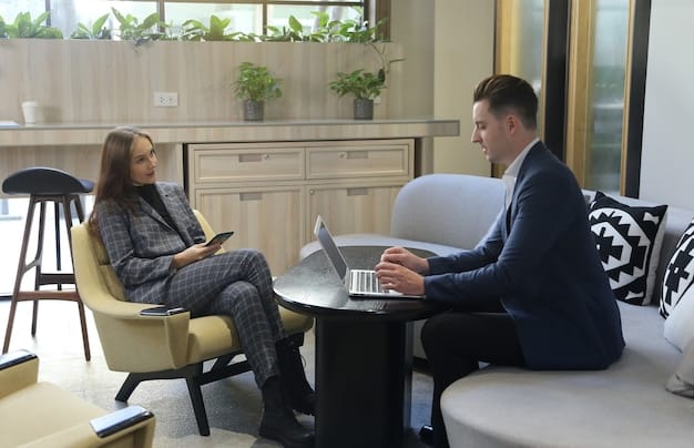 A calm, professional counselor talking empathetically with an employee in a modern, light-filled office, emphasizing confidentiality and support.