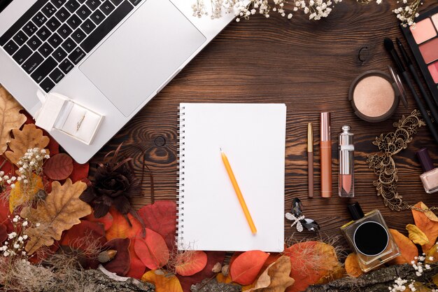 A neatly organized desk with a planner open to January 2026, a laptop displaying scholarship search results, and a set of pens, reflecting meticulous planning.