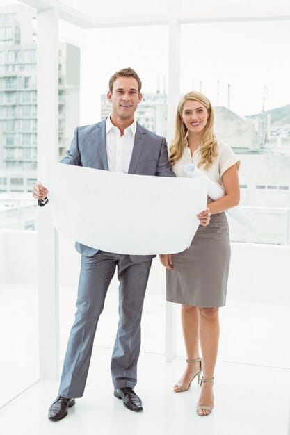Two people, one representing a business (wearing a suit, holding a blueprint) and another representing a worker (wearing casual clothes, holding a diploma/certificate), sitting at a table with an attorney or consultant, discussing immigration documents. The scene should convey collaboration and expert guidance.