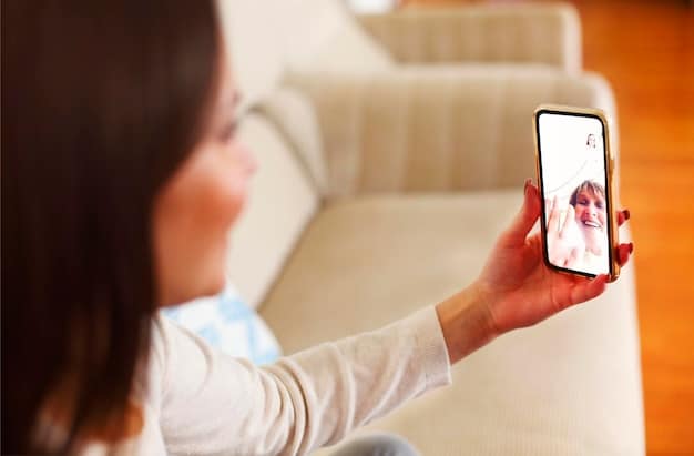 A hand holding a smartphone, with a blurred background of a living room, suggesting teletherapy. The phone screen displays a video call with a therapist. Emphasize ease of access and privacy.