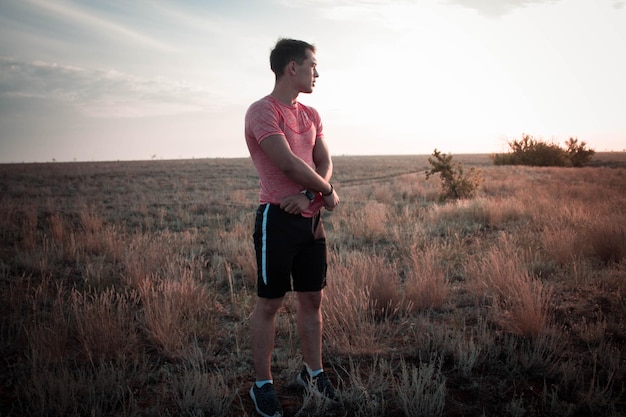 A person looking determined and focused while running on a scenic outdoor trail, showcasing a sense of achievement and self-motivation.