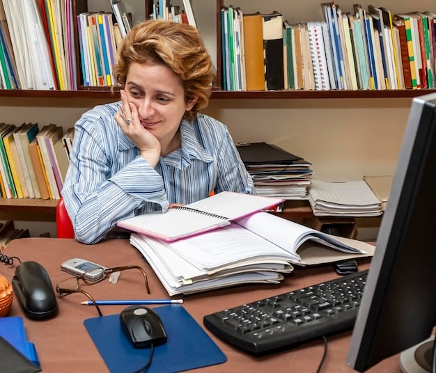 A student sitting at a desk surrounded by textbooks, a laptop, and various academic supplies, looking thoughtful about the expenses.