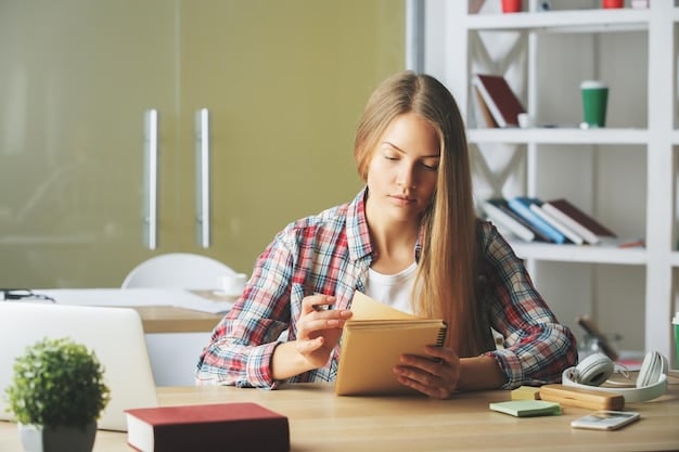 A student sitting at a desk surrounded by opened books and notes, concentrating on solving a practice test question on a tablet, indicating deep engagement with study materials.